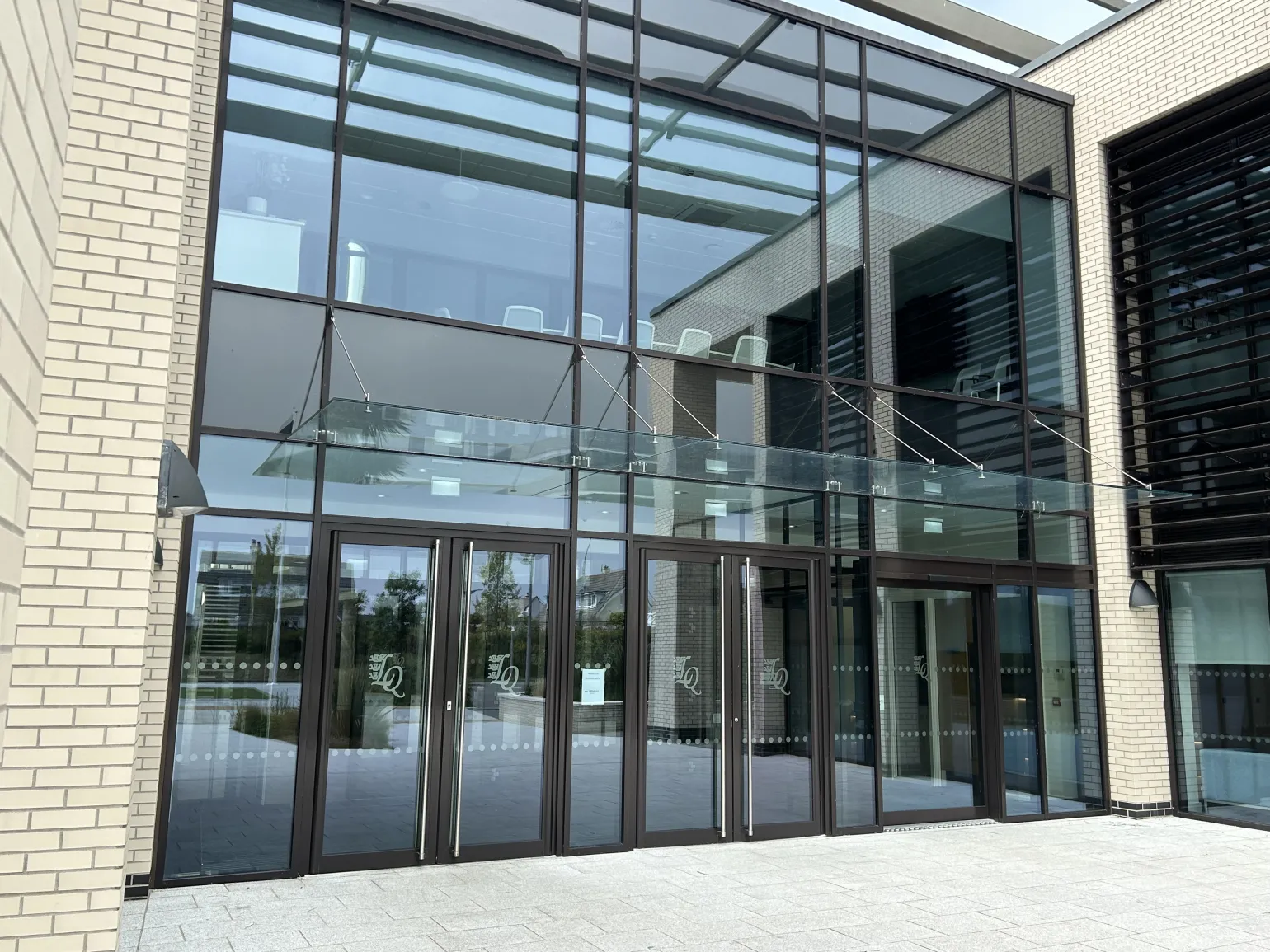 The Power of Natural Light in Education 

Studies have shown that natural light improves concentration and lifts mood, and is therefore an essential ingredient when creating environments conducive to learning and development. 

Whether in entrances, multi-level atriums or communal spaces, a large expanse of glass adds an elegant, modern touch to any building while allowing natural light to flood in and create a greater sense of space. This design approach helps schools feel less institutional and more like vibrant, inspiring places to be. 

 

Creating a Sense of Space and Openness 

At BM Architectural, our bolted glass assemblies, glass doors, glass canopies and glass balustrade are designed to maximize the flow of natural light into large indoor spaces, such as entrance halls, libraries, and common areas. These sleek, modern glass installations not only brighten up interiors but also create a more open, welcoming and connected atmosphere that encourages collaboration and creativity among students. 

Educational buildings should feel expansive and airy, not confined and restrictive. While safety is paramount, it shouldn’t come at the cost of creating a cold, fortress-like environment. The use of glass balustrades and glass stand-offs provide the perfect balance, providing essential safety barriers on high-level walkways and balconies without compromising on light or aesthetics. These features help foster a more connected environment where students and staff can engage with their surroundings, rather than feeling isolated by opaque barriers. 
