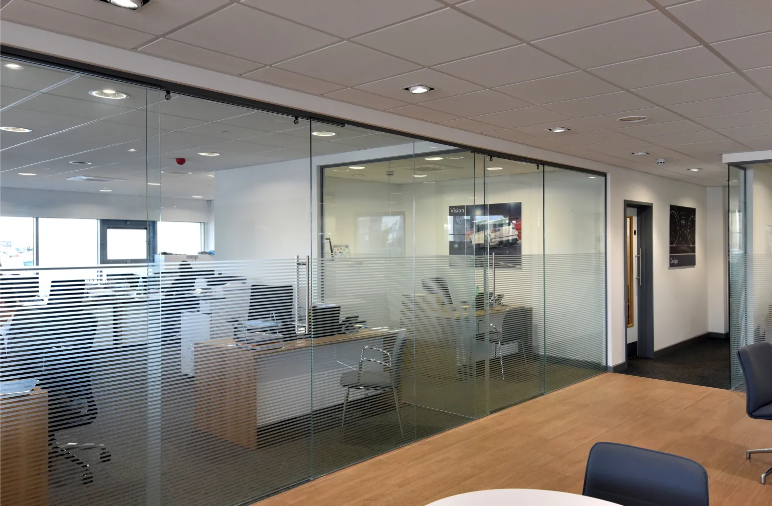 Transparent walls enable teams to stay connected visually, while providing an element of privacy and reducing distractions, improving both employee morale and productivity. 

Typically requiring no structural changes to the building and limitless layout possibilities, the EazyWall system offers long-term flexibility, with existing installations easily reconfigured if operational needs change. 

Constructed from standard, discreet 25mm wide stainless steel wall, floor and ceiling channels and associated door fittings, they accept toughened and laminated glass between 10mm and 12mm thickness.

BM Architectural has experience of supplying EazyWall partitioning system to a variety of commercial and retail environments. Contact the team on 0114 254 3226 to discuss your project requirements.
